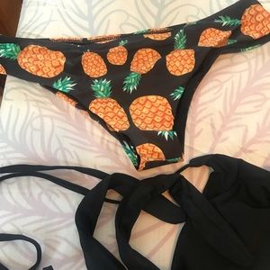 Pineapple bathing suit bottom and black top